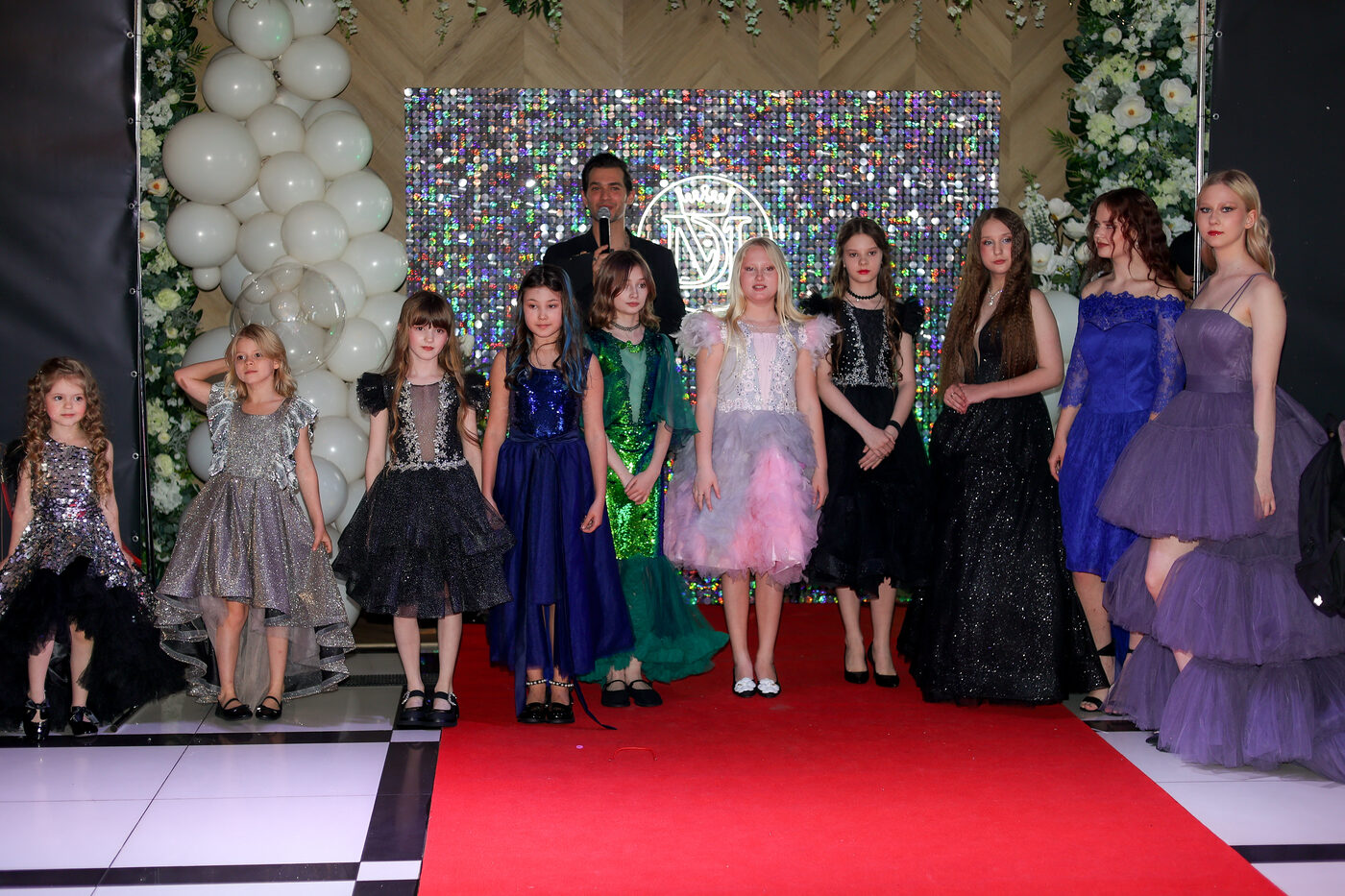 Children at a kids’ fashion show wearing outfits from the Sonechko store